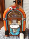 Crosley CR17 Mini Jukebox Mahogany Color. Fixed Price $50.00.