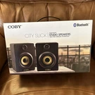 New Coby Wireless Rechargeable Bluetooth Mini Speakers, Stereo Bookshelf Audio. Fixed Price $29.95.